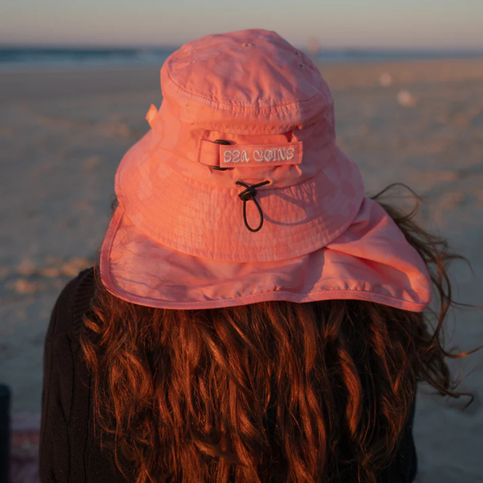 Bold two-toned coral color surf hat inspired by ocean reefs