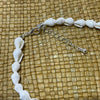 Natural white shell anklet showing adjustable chain and coastal charm, summer beach accessory