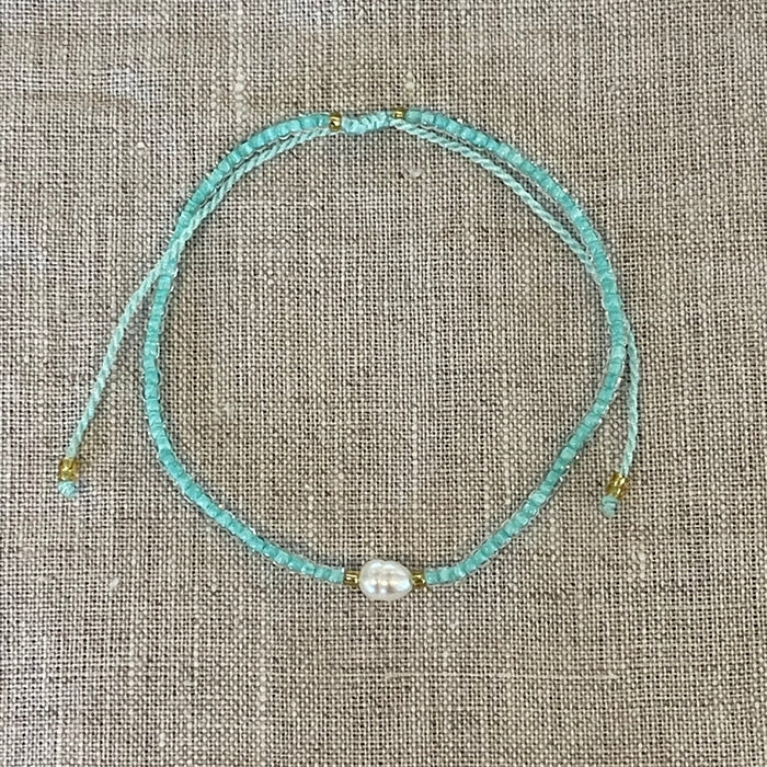 Extendable pearl bead bracelet showing delicate beads and adjustable chain, coastal accessory