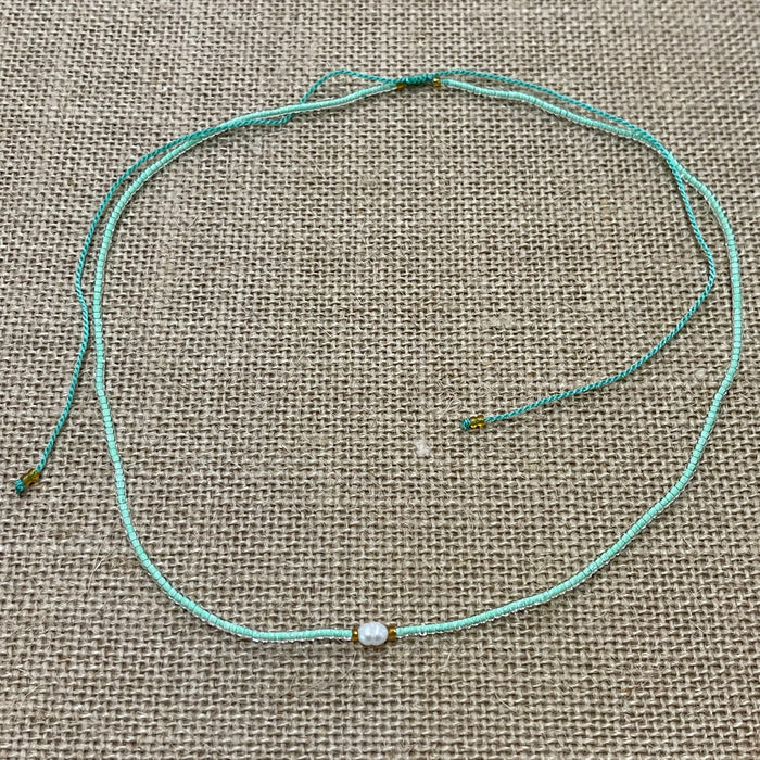 Mint pearl bead necklace showing single pearl and ocean beads, coastal accessory