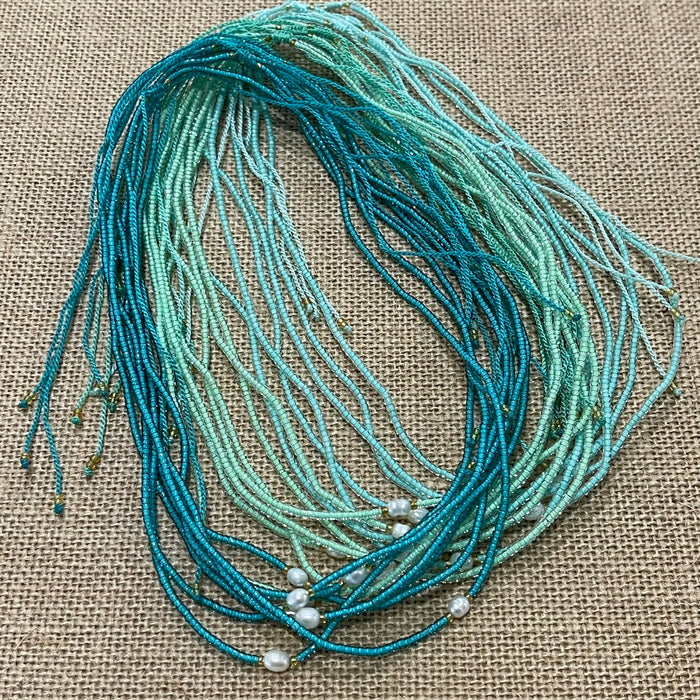 Pearl bead necklace with single pearl on ocean-coloured beads, adjustable coastal jewellery