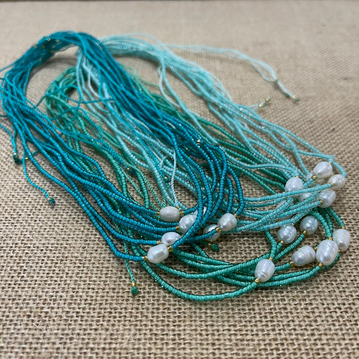 Pearl bead necklace with single pearl on ocean-coloured beads, adjustable coastal jewellery