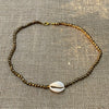 Bronze cowrie shell beaded necklace showing natural shells and beads, coastal accessory