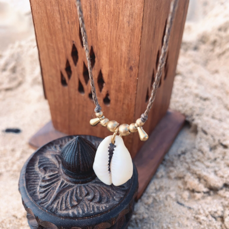 Adjustable cowrie shell choker necklace detail view