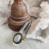 Purnima moonstone ring with luminous white stone set in sterling silver, reflecting ocean-inspired coastal elegance