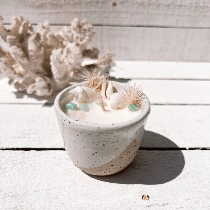 Oceana ceramic candle with seashells, turquoise crystals, and dried botanicals