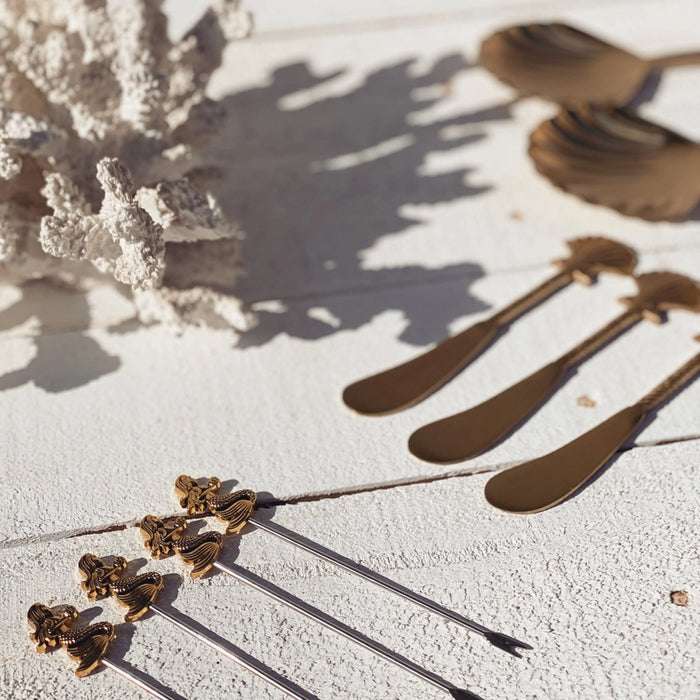 Brass seashell cheese knife styled for entertaining