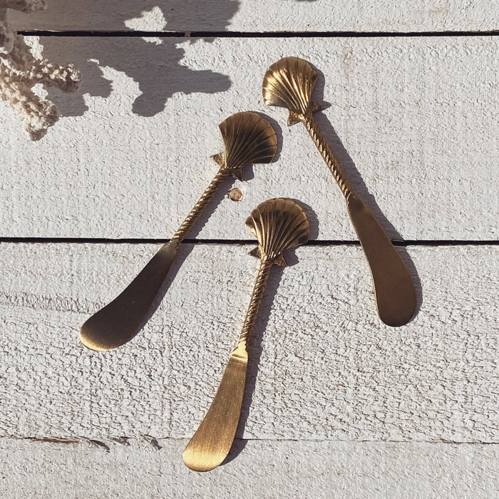 Brass seashell cheese knife styled for entertaining