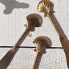 Brass seashell cheese knife styled for entertaining