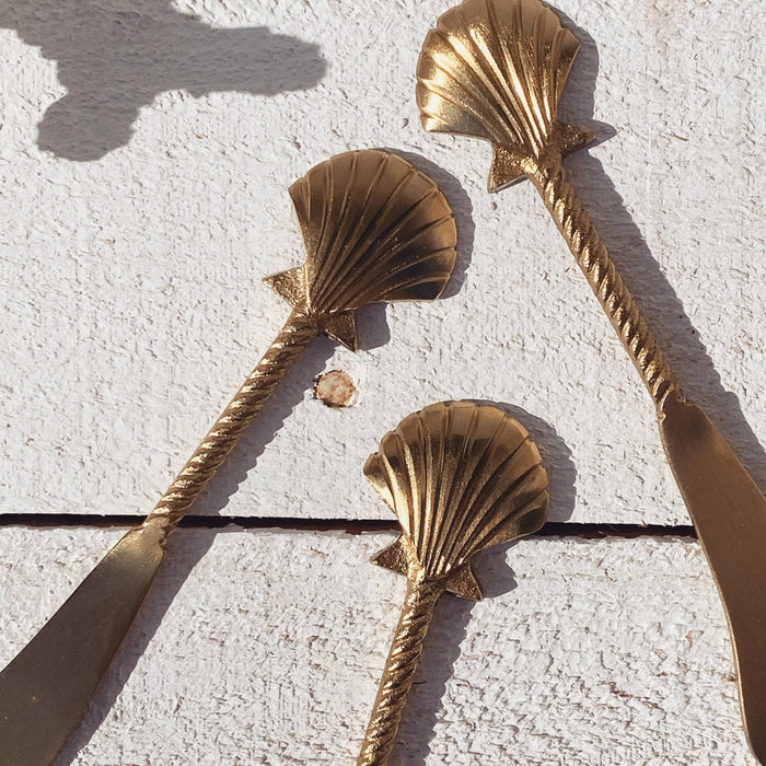 Brass seashell cheese knife styled for entertaining