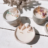 Oceana ceramic candle with seashells, turquoise crystals, and dried botanicals