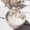 Oceana ceramic candle with seashells, turquoise crystals, and dried botanicals