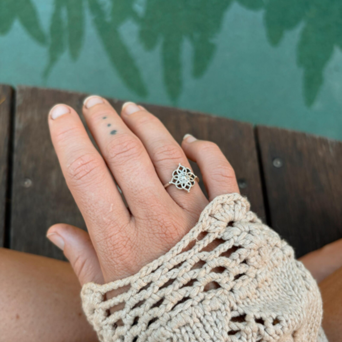 Adjustable silver mandala ring detail showing how band fits different sizes