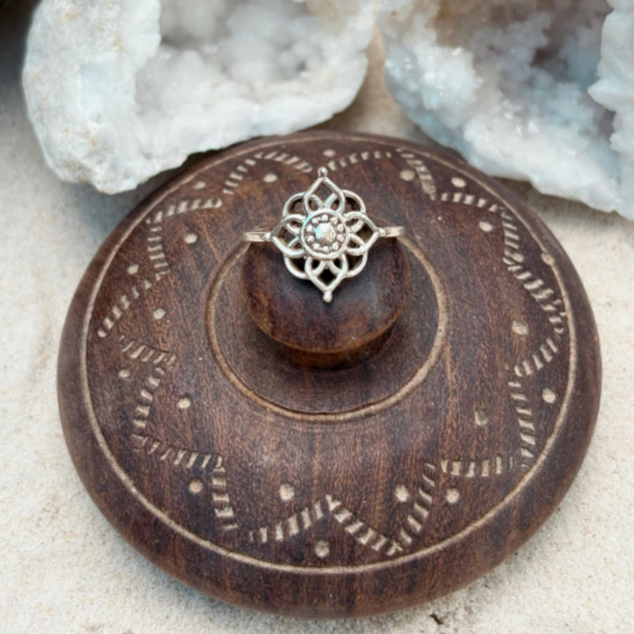 Sterling silver mandala ring with intricate geometric design worn on hand showing adjustable fit