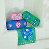 Fiesta Heart glasses case and matching cleaning cloth – hard shell protective case with bold heart design (15 × 6 cm).